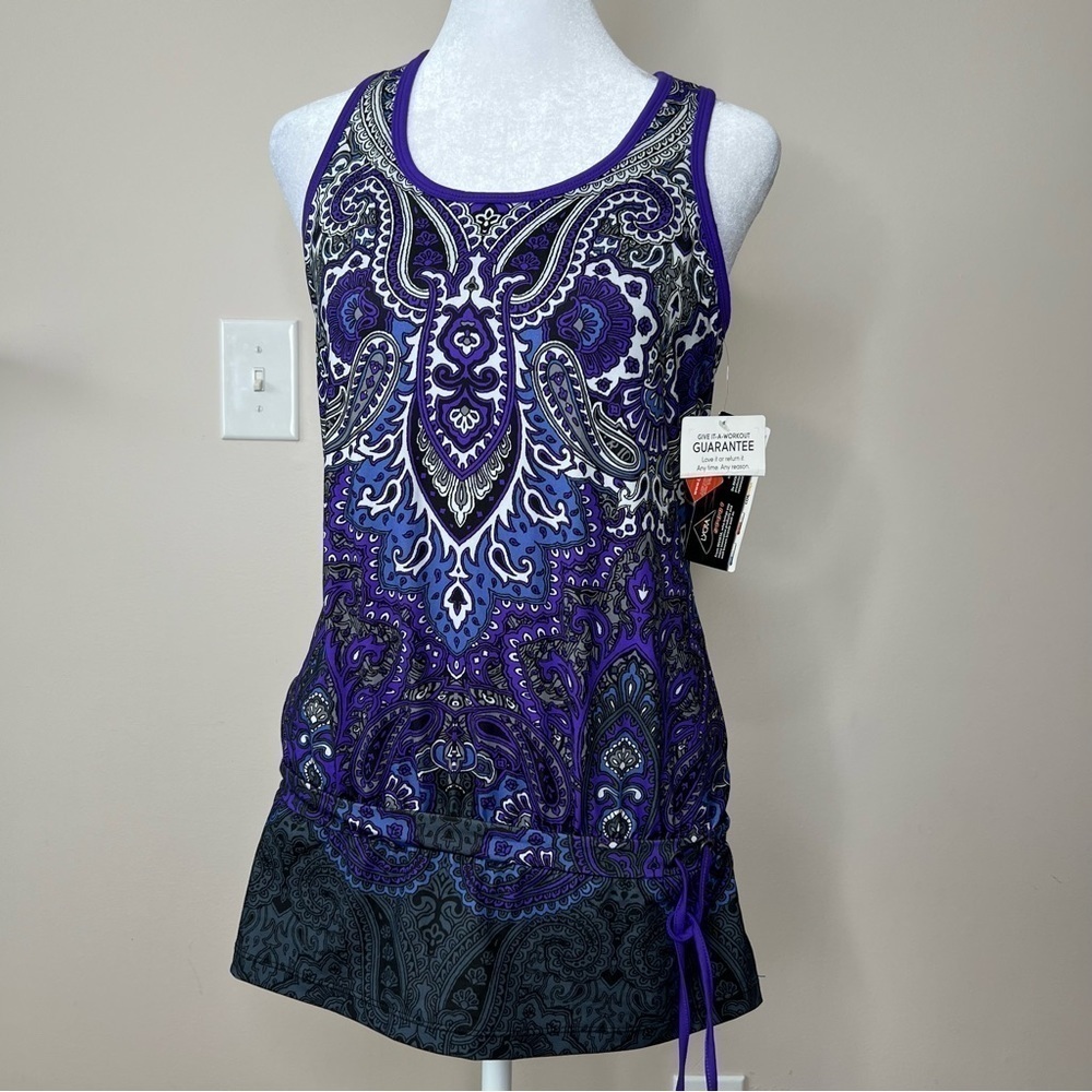 ! NWT. ATHLETA TIC TAC TOE PURPLE PAISLEY
BLOUSY FITNESS TANK TOP